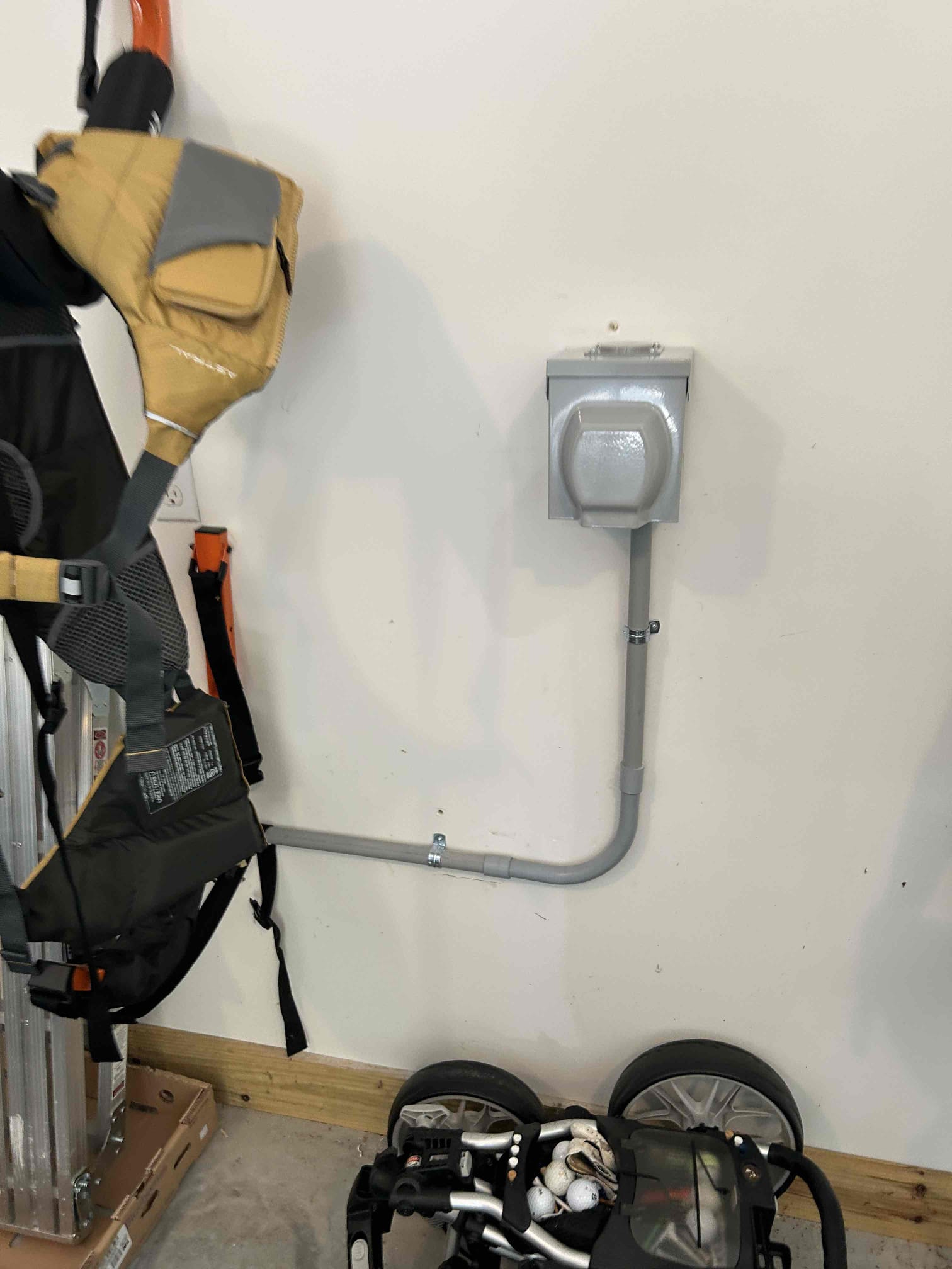 Electrician assessing electrical needs for ev charging station installation