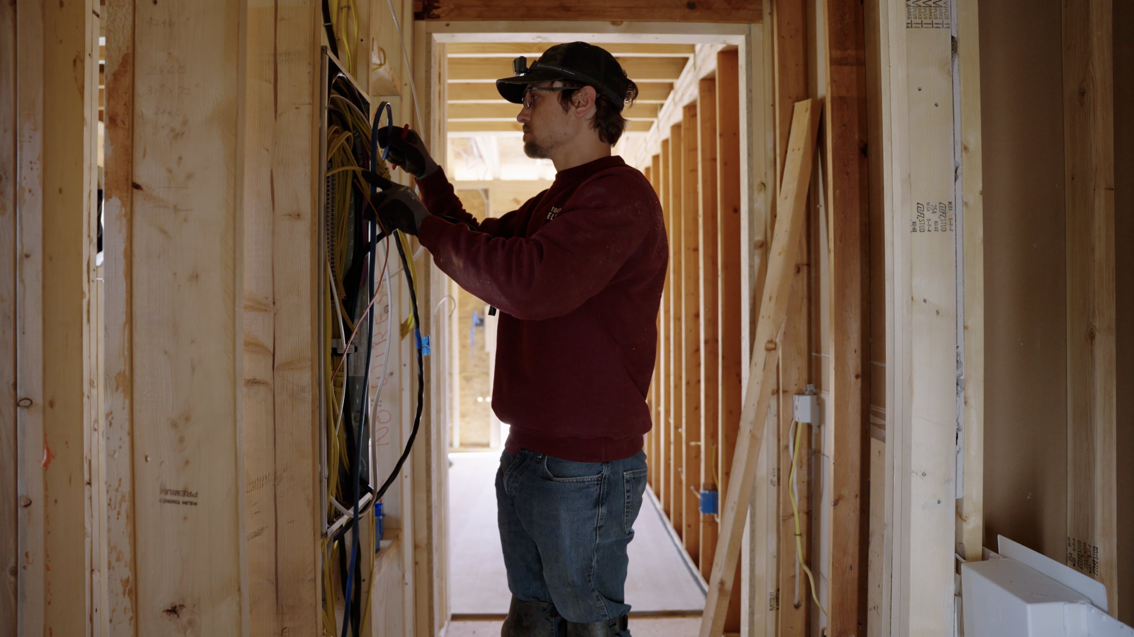 Electrician assessing electrical needs for electrical panel upgrades