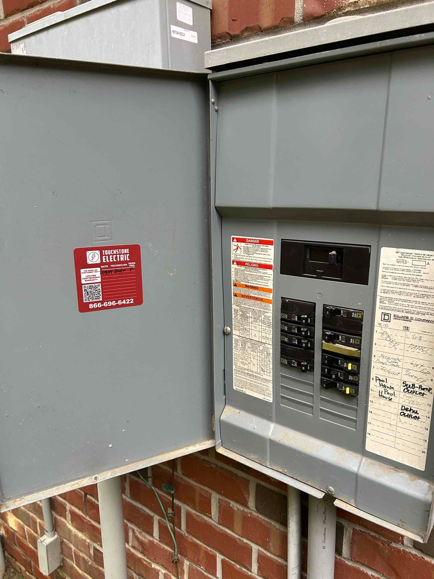 Touchstone Electric electrician wiring a residential subpanel