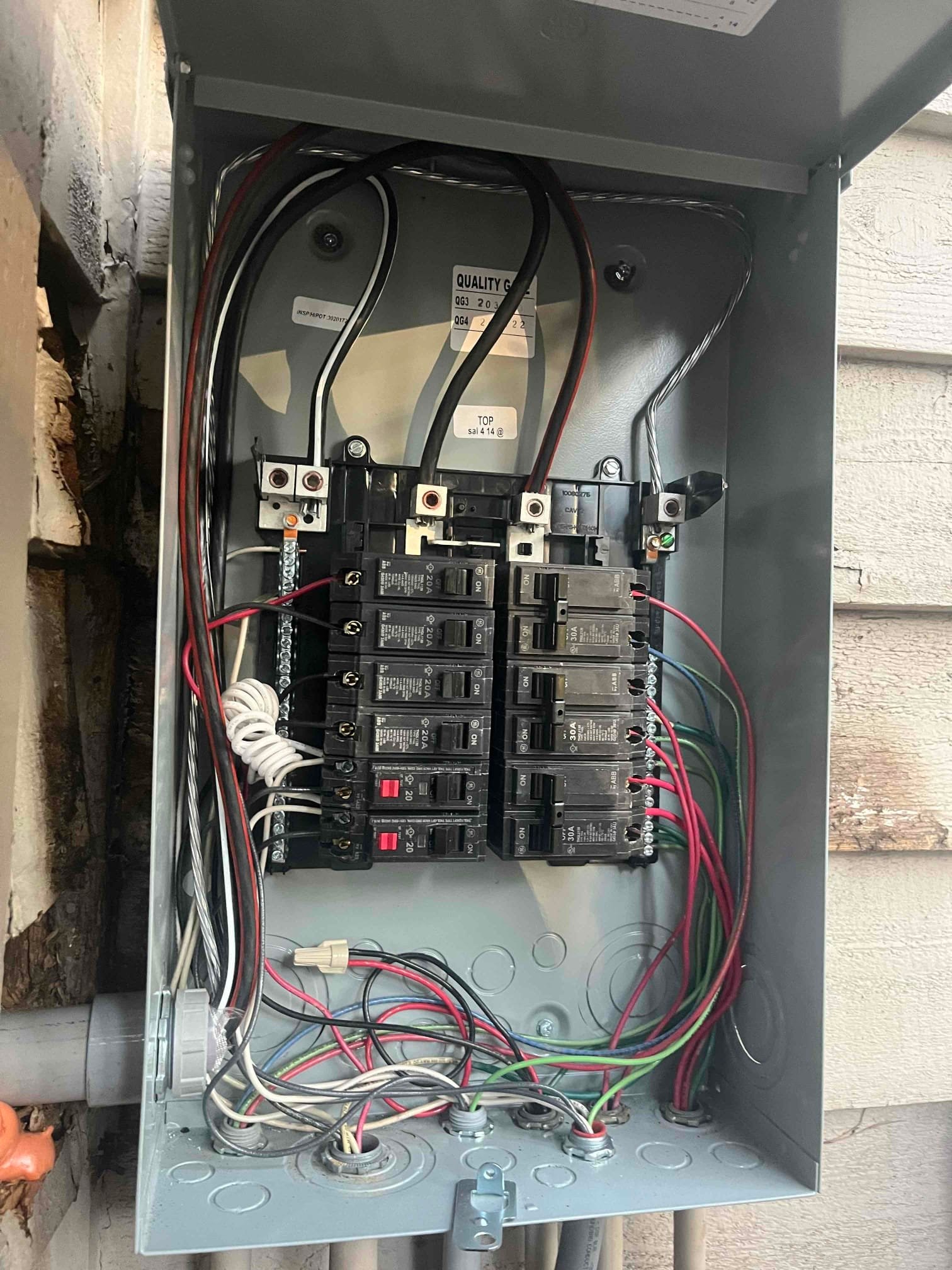 Touchstone Electric electrician wiring a residential subpanel