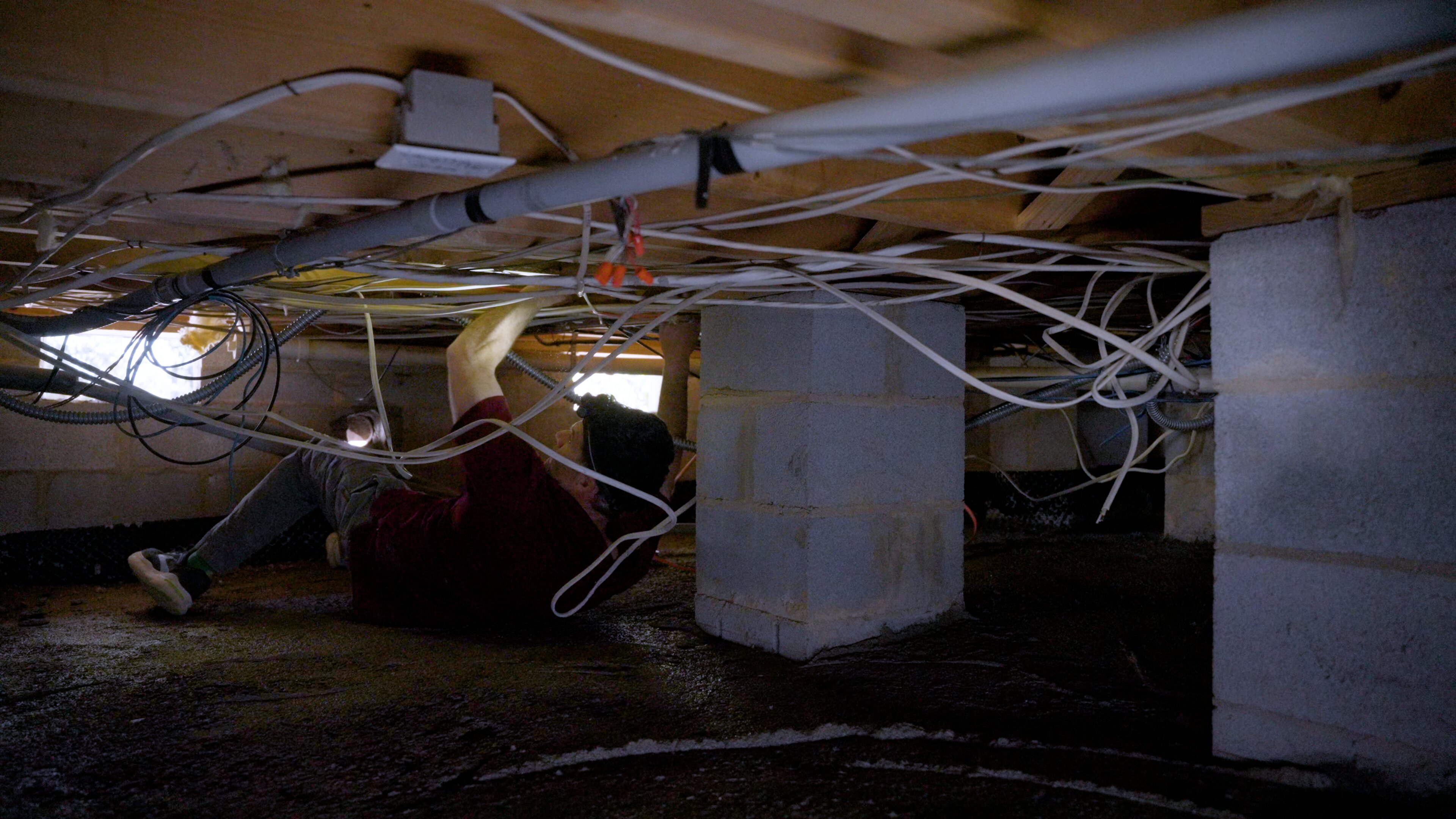 Electrician diagnosing an electrical problem