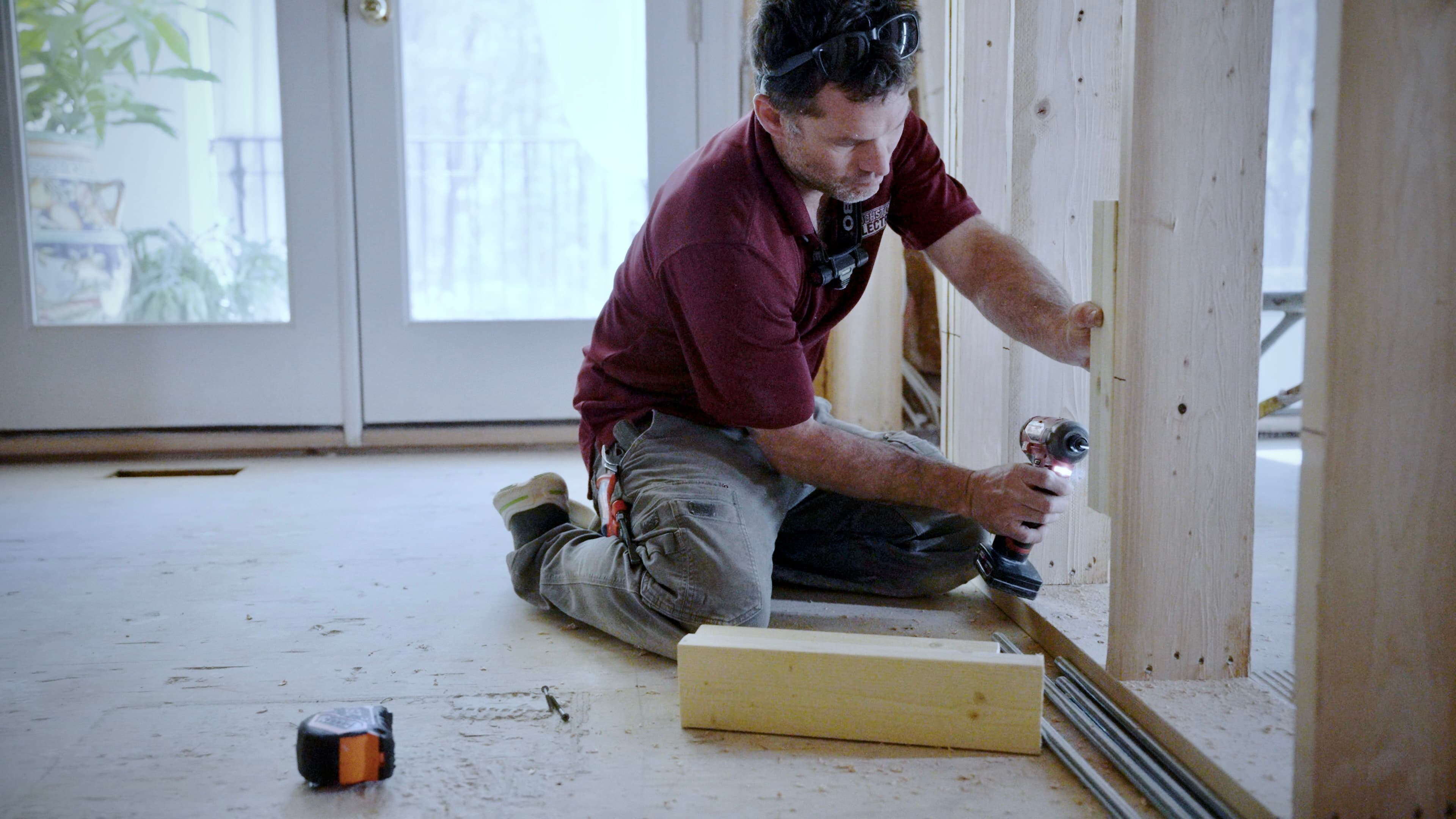 Touchstone Electric technicians reviewing a project plan on site