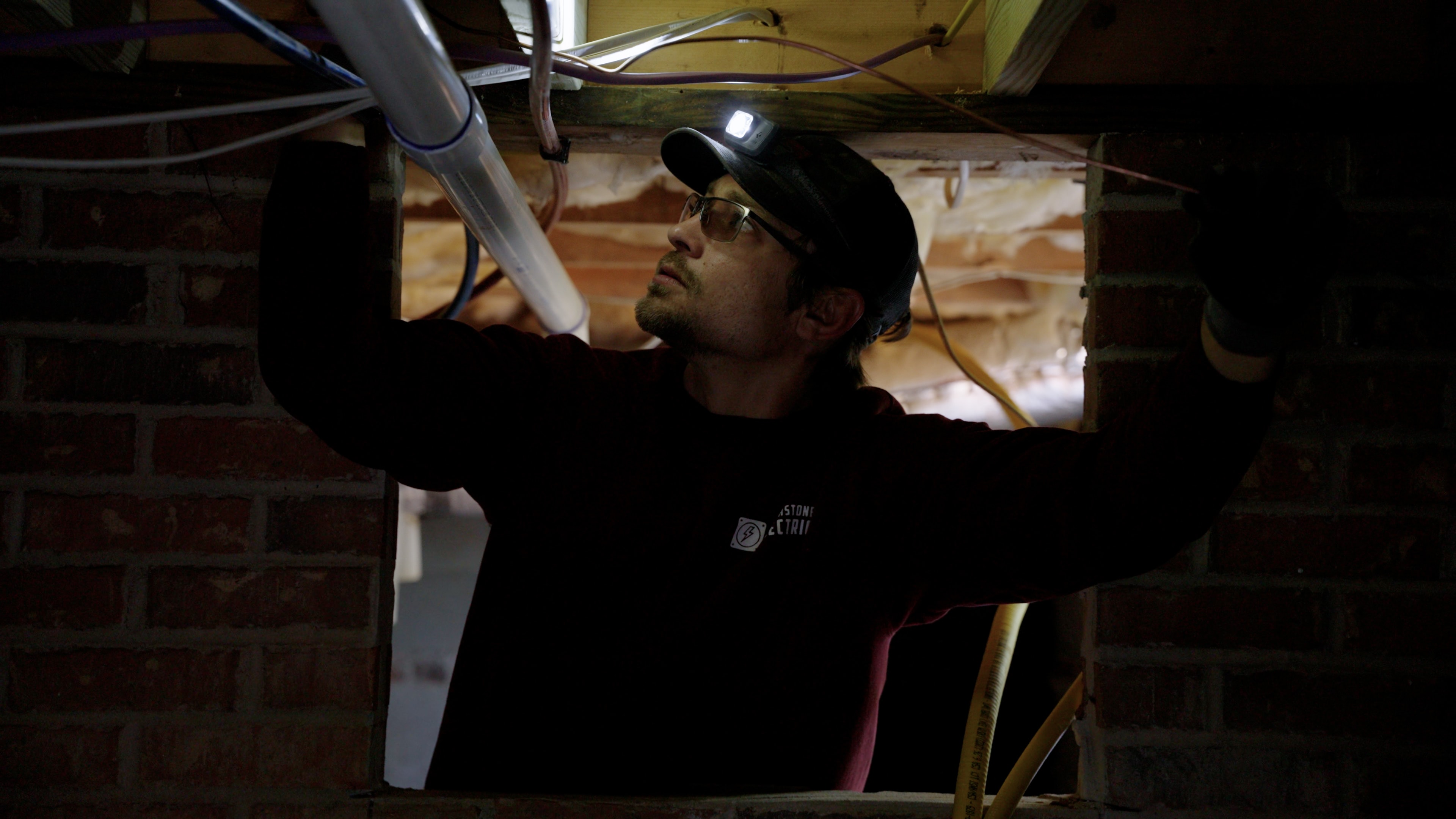 Touchstone Electric technician rewiring a home